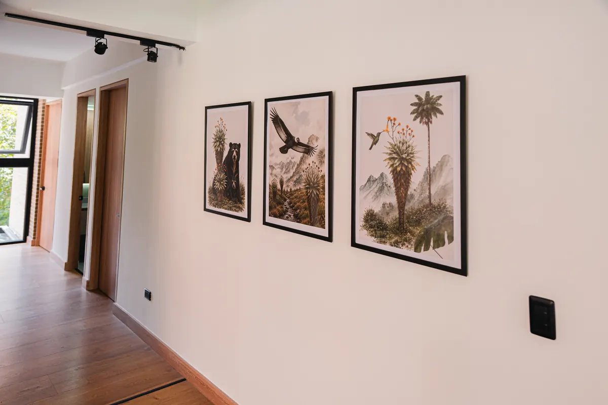Hallway with framed botanical and wildlife prints from Colombia