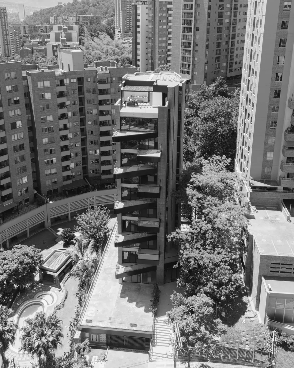 Aerial view of the Altitud building among the trees of Castropol